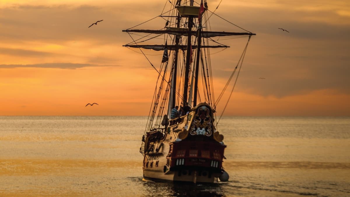 A pirate ship sailing on sea during golden hour 37730 - FI